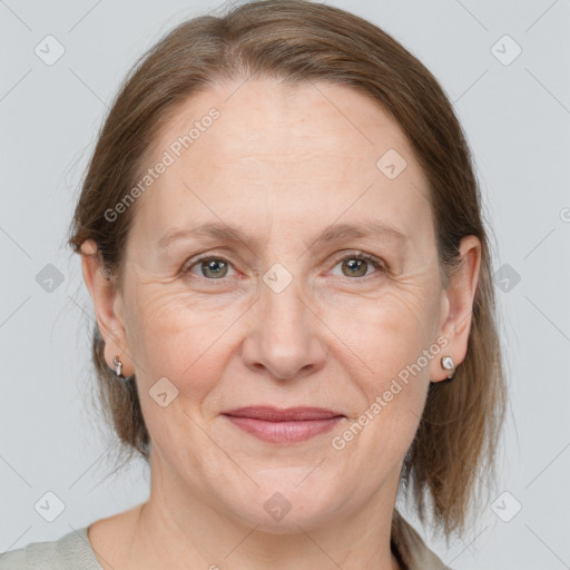 Joyful white adult female with medium  brown hair and grey eyes