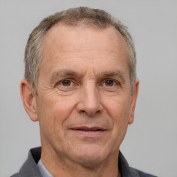 Neutral white middle-aged male with short  gray hair and brown eyes