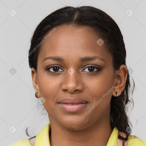 Joyful black young-adult female with short  brown hair and brown eyes