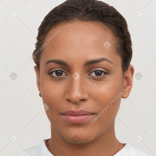 Joyful latino young-adult female with short  brown hair and brown eyes