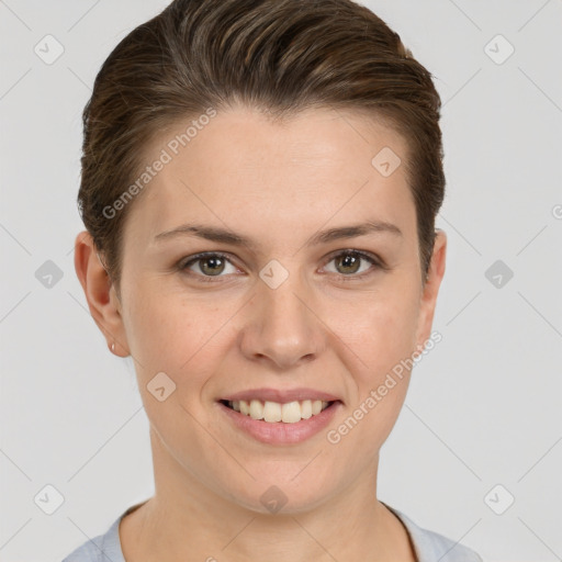 Joyful white young-adult female with short  brown hair and grey eyes