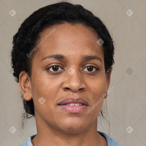 Joyful black adult female with short  brown hair and brown eyes