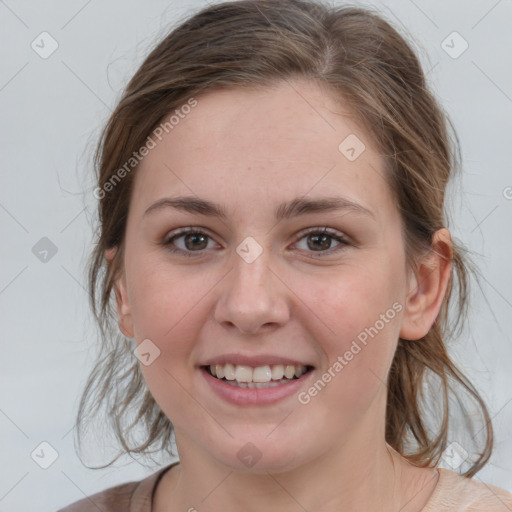 Joyful white young-adult female with medium  brown hair and grey eyes