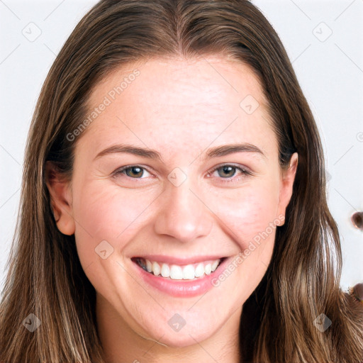 Joyful white young-adult female with long  brown hair and blue eyes