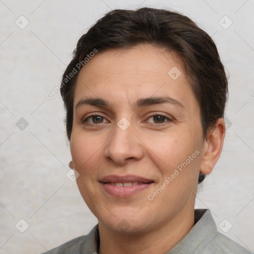 Joyful white adult female with short  brown hair and brown eyes