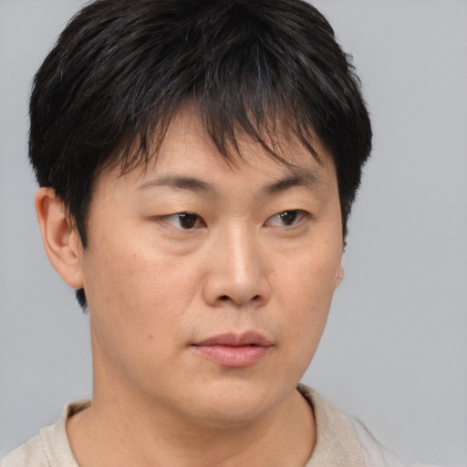 Neutral asian young-adult female with short  brown hair and brown eyes