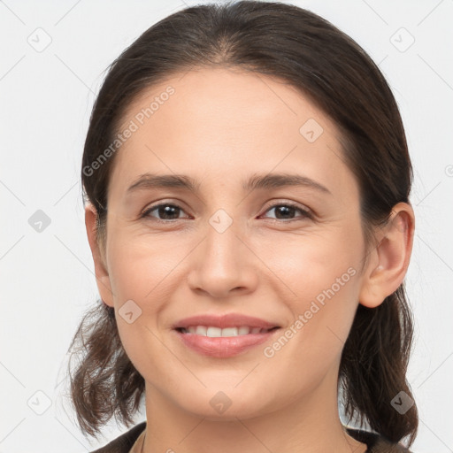 Joyful white young-adult female with medium  brown hair and brown eyes