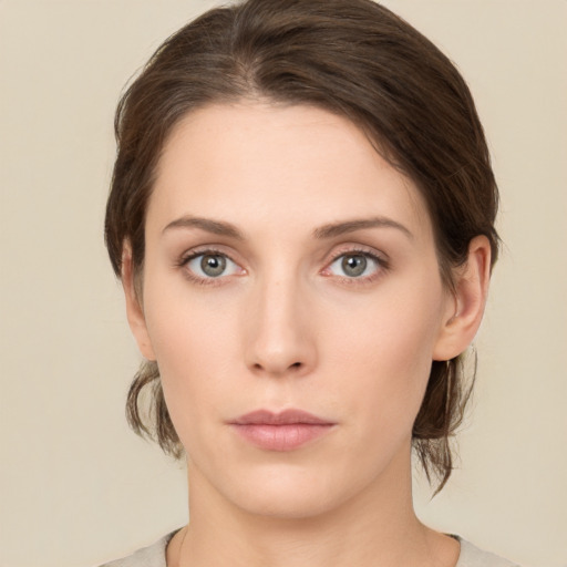 Neutral white young-adult female with medium  brown hair and green eyes