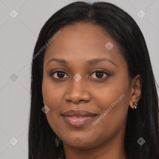 Joyful black young-adult female with long  black hair and brown eyes