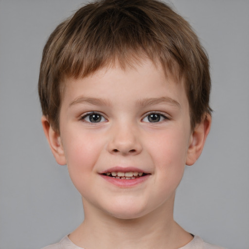 Joyful white child male with short  brown hair and brown eyes