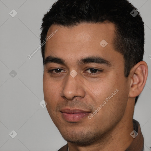 Joyful white young-adult male with short  black hair and brown eyes