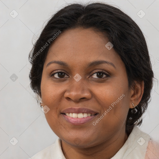 Joyful black adult female with medium  brown hair and brown eyes