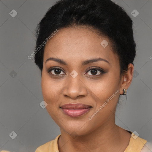 Joyful black young-adult female with short  brown hair and brown eyes