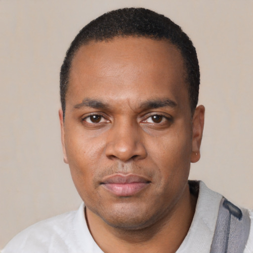 Neutral black young-adult male with short  black hair and brown eyes