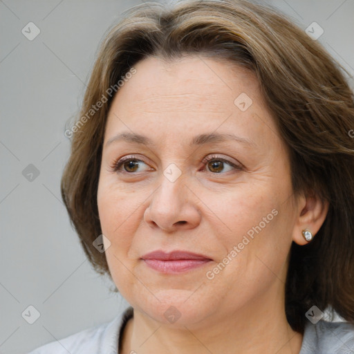 Joyful white adult female with medium  brown hair and brown eyes