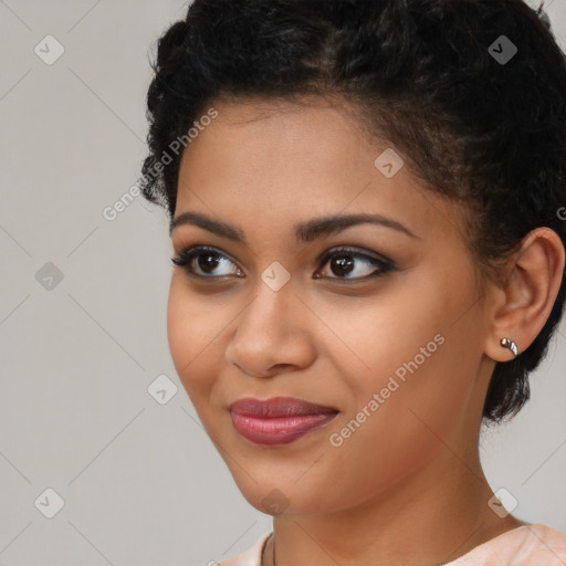 Joyful latino young-adult female with short  black hair and brown eyes