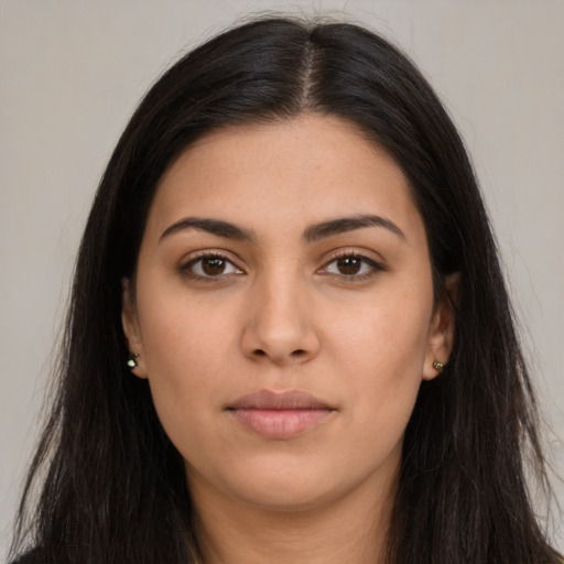 Neutral latino young-adult female with long  brown hair and brown eyes