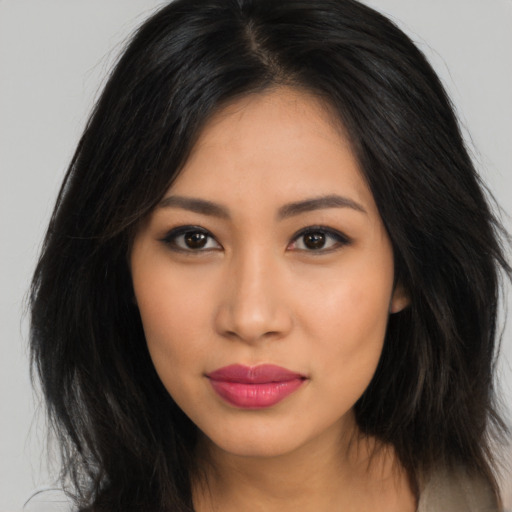 Neutral latino young-adult female with long  black hair and brown eyes