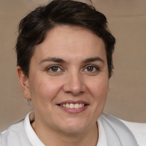 Joyful white adult female with short  brown hair and brown eyes