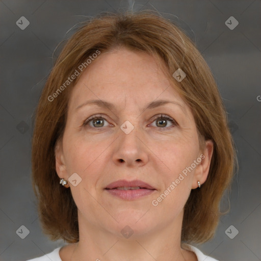 Joyful white adult female with medium  brown hair and grey eyes