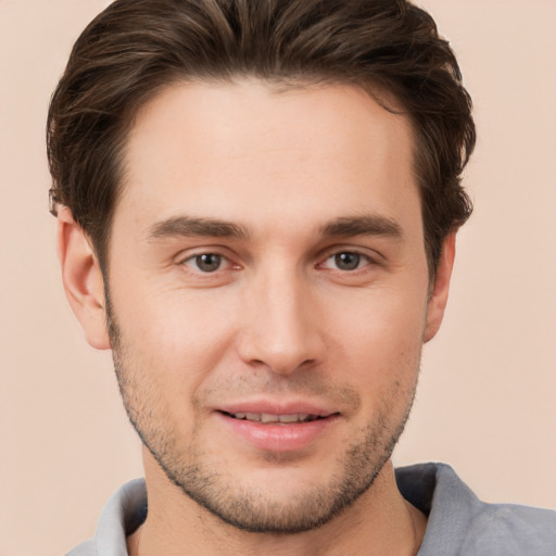 Joyful white young-adult male with short  brown hair and brown eyes