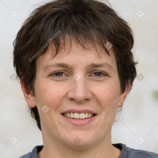 Joyful white adult female with short  brown hair and grey eyes