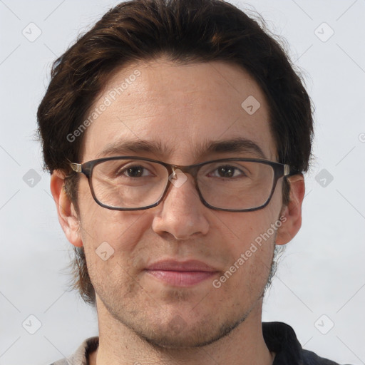 Joyful white adult male with short  brown hair and brown eyes