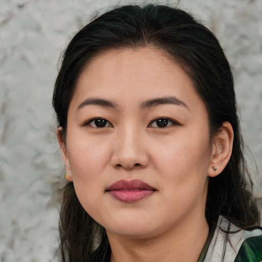 Joyful asian young-adult female with medium  brown hair and brown eyes