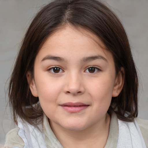 Joyful white child female with medium  brown hair and brown eyes