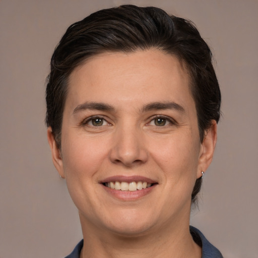 Joyful white adult female with short  brown hair and brown eyes