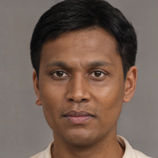 Neutral black adult male with short  black hair and brown eyes