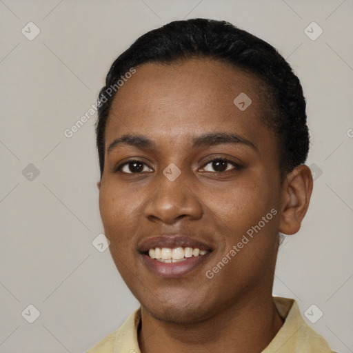 Joyful black young-adult female with short  black hair and brown eyes