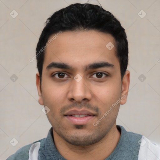 Neutral latino young-adult male with short  black hair and brown eyes