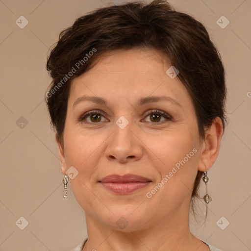 Joyful white adult female with short  brown hair and brown eyes