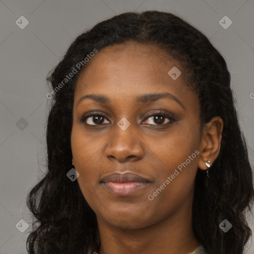 Joyful black young-adult female with long  black hair and brown eyes