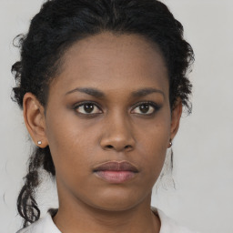 Neutral black young-adult female with long  brown hair and brown eyes