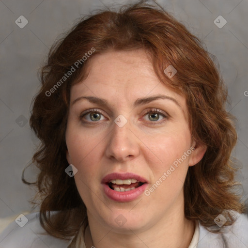 Joyful white adult female with medium  brown hair and blue eyes