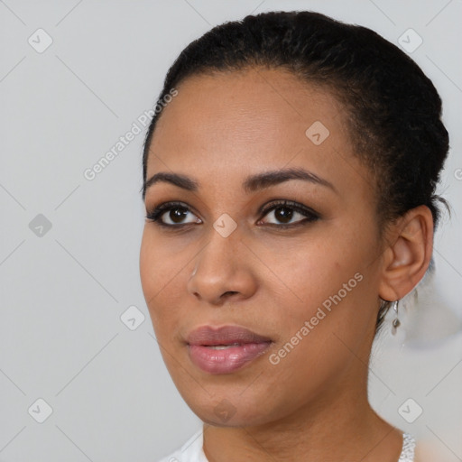 Joyful black young-adult female with short  black hair and brown eyes