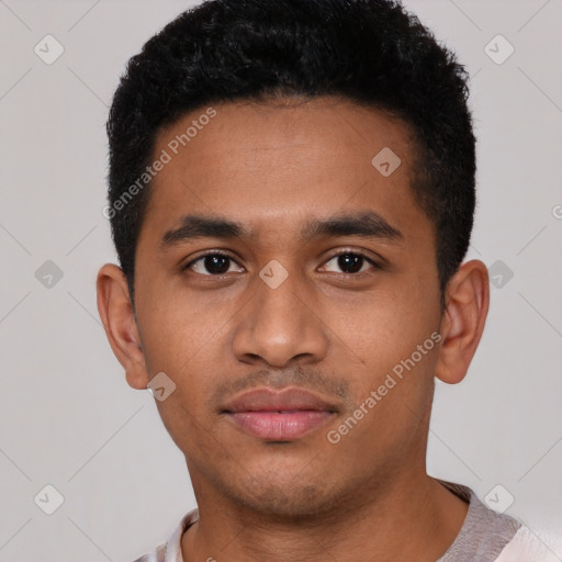 Neutral latino young-adult male with short  black hair and brown eyes