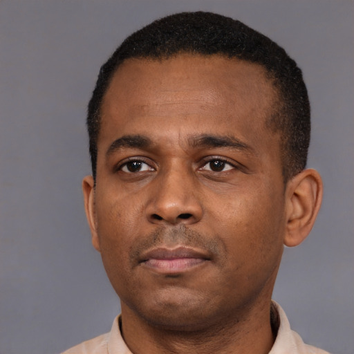Neutral latino adult male with short  black hair and brown eyes