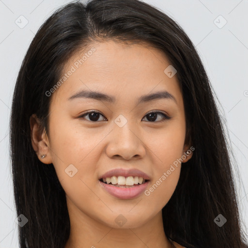 Joyful asian young-adult female with long  brown hair and brown eyes