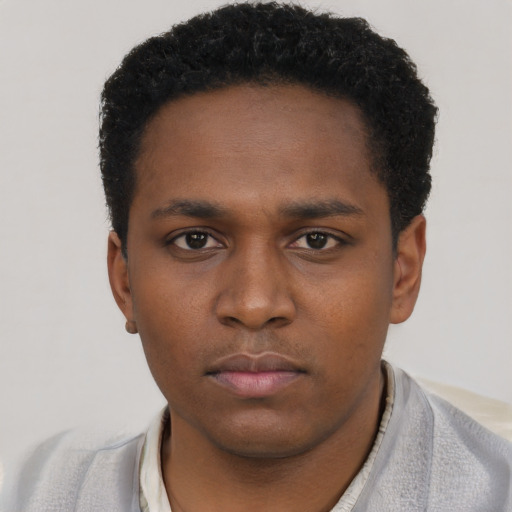 Neutral black young-adult male with short  brown hair and brown eyes