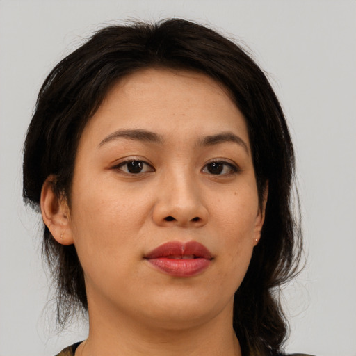 Joyful asian young-adult female with medium  brown hair and brown eyes