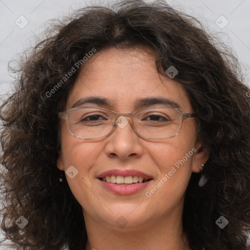 Joyful white adult female with long  brown hair and brown eyes