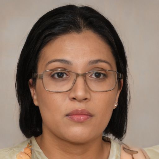 Neutral asian adult female with medium  brown hair and brown eyes