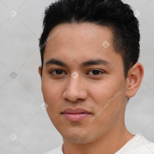 Joyful latino young-adult male with short  brown hair and brown eyes