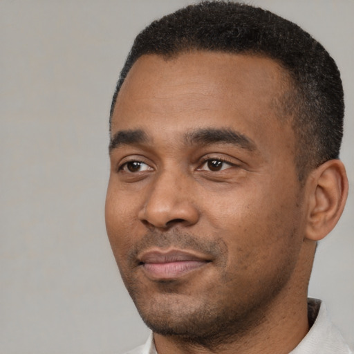Neutral black young-adult male with short  black hair and brown eyes