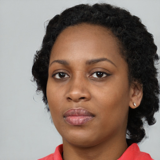 Neutral black young-adult female with long  black hair and brown eyes