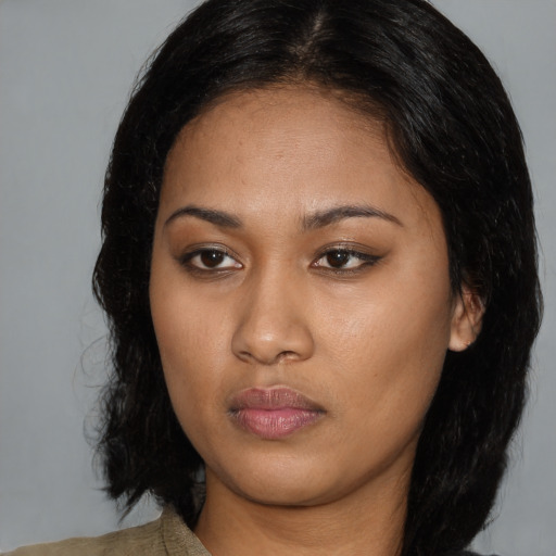 Neutral black young-adult female with medium  black hair and brown eyes