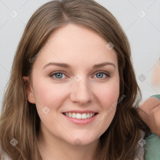 Joyful white young-adult female with long  brown hair and green eyes